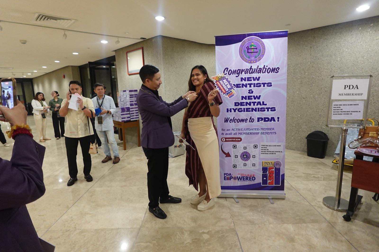 New PDA member being welcomed at the induction photo booth