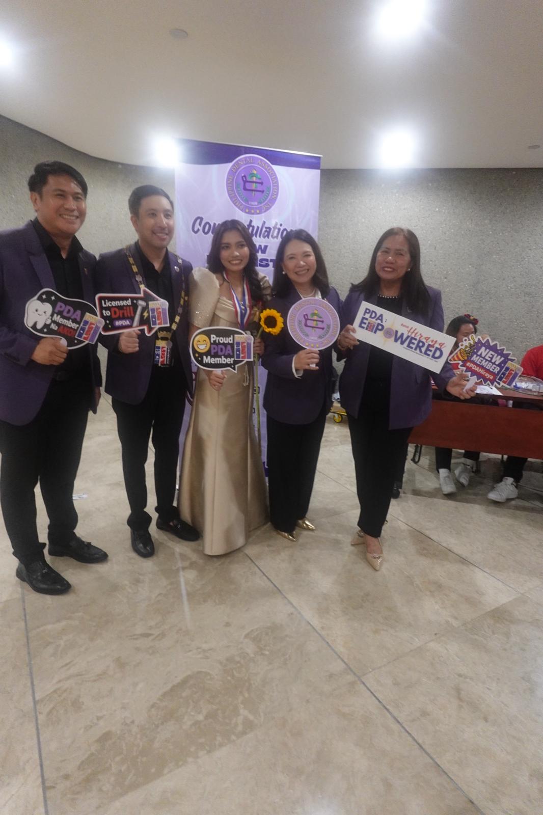New PDA members celebrating with PDA officers at the induction photo booth